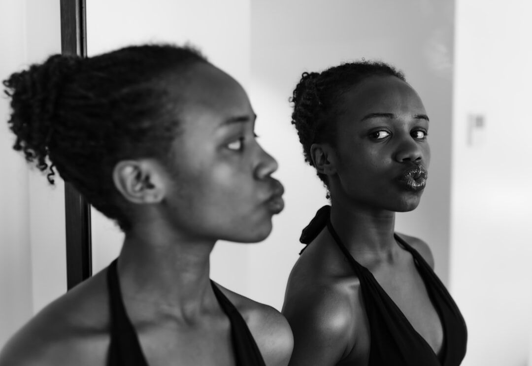 person practicing speech in mirror