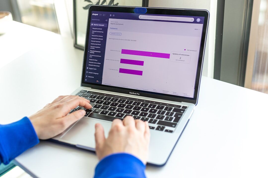 person sending email on laptop