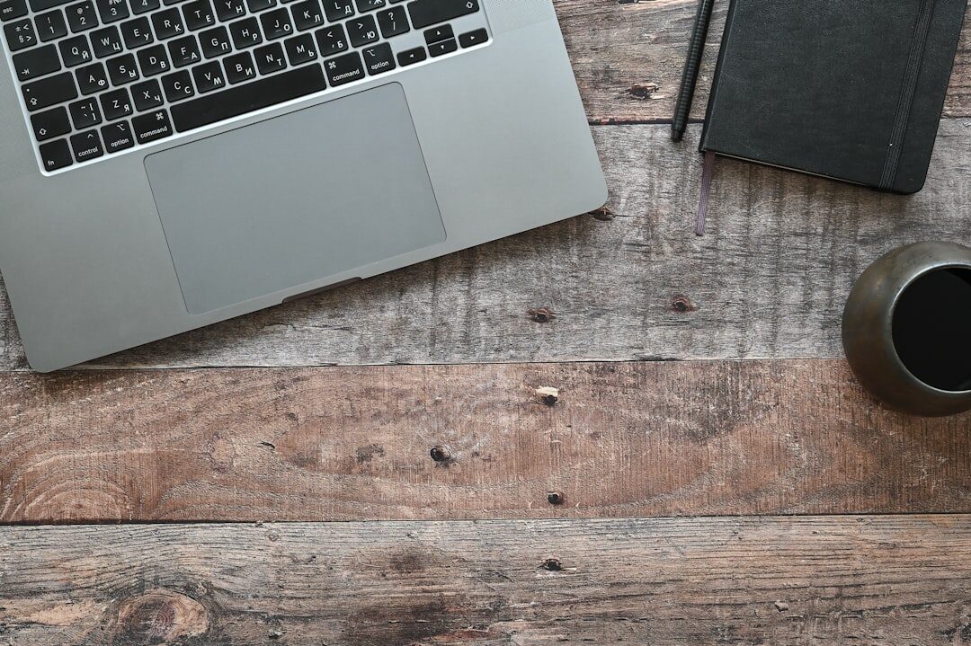 Open notebook with handwritten notes on a wooden desk